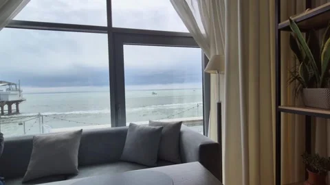 A table in a restaurant or a cozy hotel room with a sea view Stock Footage 309677330