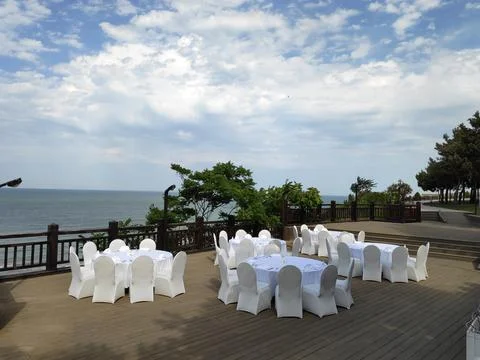 Table in the restaurant on the sea background Stock Photos