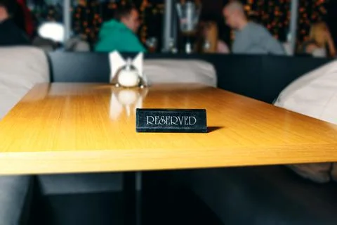 Table in the restaurant - the table is reserved. Stock Photos