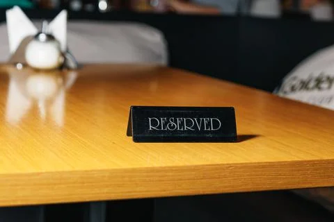 Table in the restaurant - the table is reserved. Stock Photos
