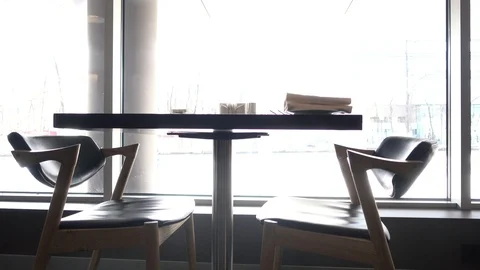 Table in restaurant for two against window Video stock 88167088