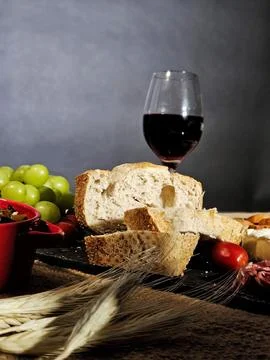 Table with rustic bread and red wine Stock Photos