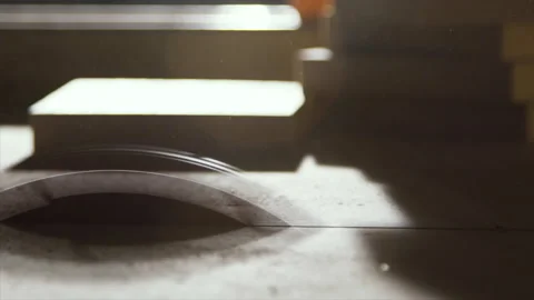 Table saw blade spinning down to a stop, teeth in silhouette Stock Footage 346255995