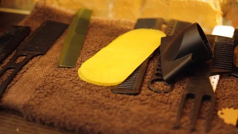 Table with scissors and trimmers at the barber shop, making of haircuts Stock Footage