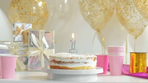 Table served for Birthday dinner in living room. First year 1080p fullHD Stock Footage 75891014