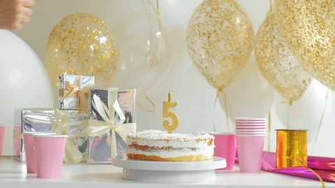 Table served for Birthday dinner in living room. five years 1080p fullHD Stock Footage 75891082