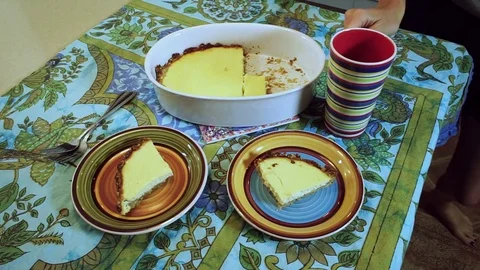 Table served for breakfast. Plates with slices of baked pudding, cup for tea. HD Stock Footage 71799840