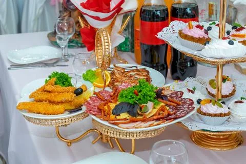 The table is served with cold snacks at the banquet Stock Photos
