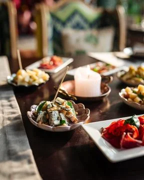 Table served with the different gourmet appetizers Stock Photos