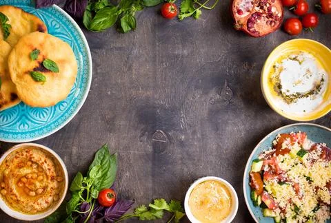  Table served with middle eastern vegetarian dishes. Hummus, tahini, pitta... Stock Photos