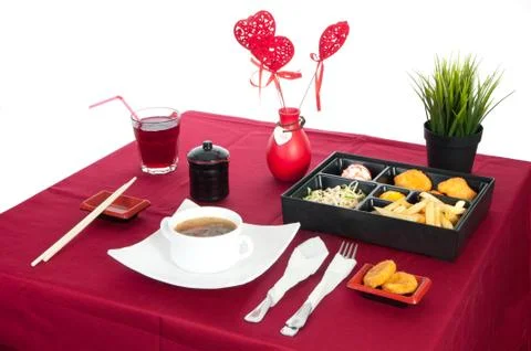 Table with served table with breakfast and drink, tablecloth red, cutlery.. C Stock Photos