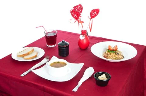 Table with served table with breakfast and drink, tablecloth red, cutlery.. C Stock Photos