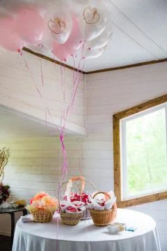 Table serving with baskets, flowers and balloons 写真素材