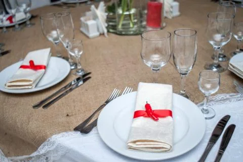 Table serving with carnations and anemone flowers, table, fork, knife, plate, Stock Photos
