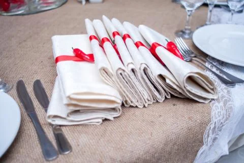 Table serving with carnations and anemone flowers, table, fork, knife, plate, Stock Photos