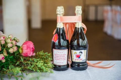 Table serving with flowers and champagne bottles in hall Fotos Stock