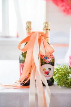 Table serving with flowers and champagne bottles in hall 스톡 사진
