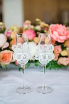 Table serving with glasses and flowers in hall Stock Photos