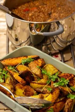 A table set with chilli and potato wedges, with selective focus Stock Photos