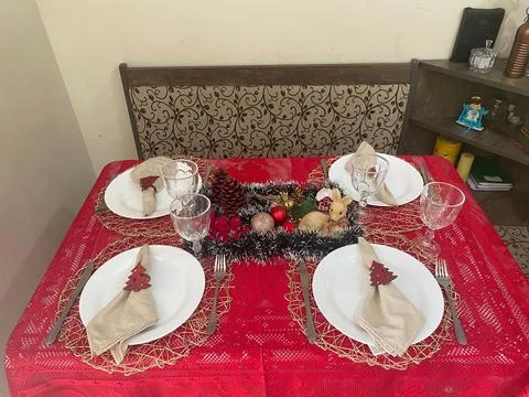 A table set with Christmas decorations Stock Photos