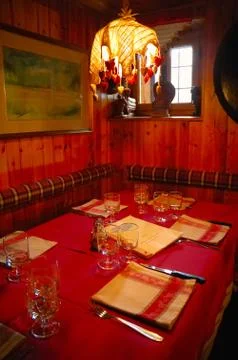 Table set for dinner inside a mountain restaurant Stock Photos