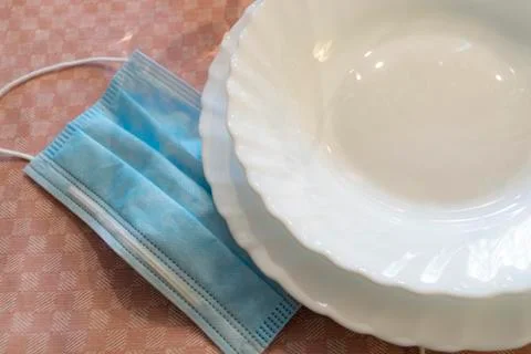 Table set up with dinnerware and silverware, ready for a meal. with surgical Stock Photos