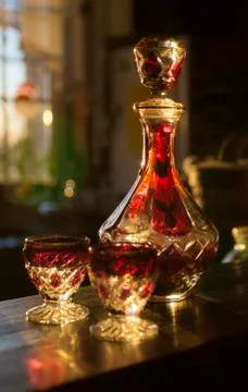 Table set for drinking alcohol. Soviet carafe for vodka and two glasses. Stock Photos