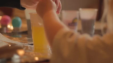 A Table Set for Dyeing and Decorating Easter Eggs Stock Footage 102349451