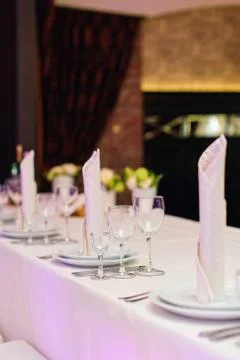 Table set for an elegant dinner in a restaurant Stock Photos
