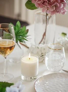Table set for an event party or wedding reception with burning candle Stock Photos