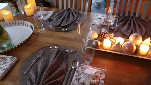 Table set for festive dinner at Christmas inside private home Stock Footage 284876823
