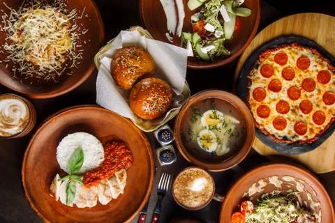 The table is set for a four course meal. Photos