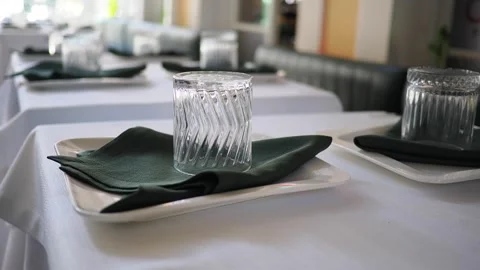 Table set with glasses and napkins for guests 스톡 동영상 339379494