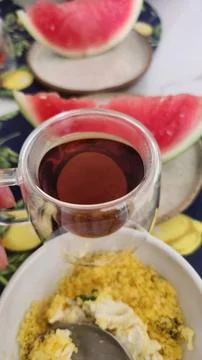 A table set for a healthy breakfast with eggs and fruit and a cup of coffee. Stock Photos