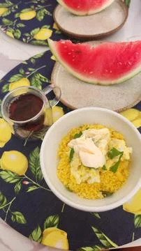 A table set for a healthy breakfast with eggs and fruit and a cup of coffee. Stock Photos