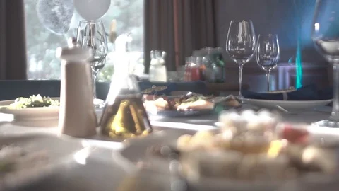 Table set for the holiday. Close-up of wine glasses on a table. Video stock 123540940