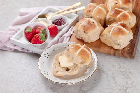 Table set with hot cross buns and tea for Easter Stock Photos