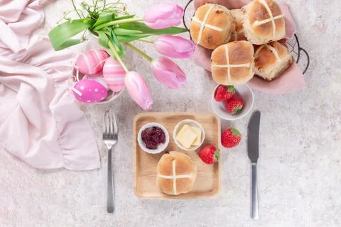 Table set with hot cross buns and tea for Easter Stock Photos