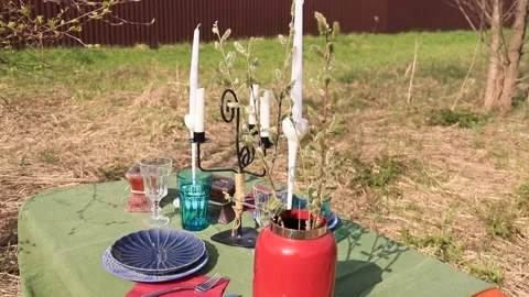 A table set in nature at the dacha in spring for lunch or dinner Stock Footage 193105910