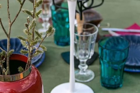 A table set in nature at the dacha in spring for lunch or dinner Stock Photos