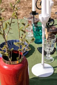 A table set in nature at the dacha in spring for lunch or dinner Stock Photos