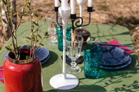 A table set in nature at the dacha in spring for lunch or dinner Stock Photos