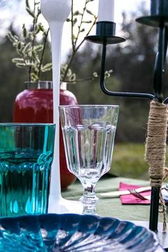 A table set in nature at the dacha in spring for lunch or dinner Stock Photos