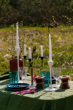 A table set in nature at the dacha in spring for lunch or dinner Stock Photos