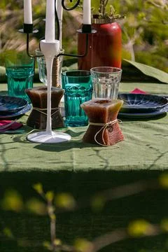 A table set in nature at the dacha in spring for lunch or dinner Stock Photos
