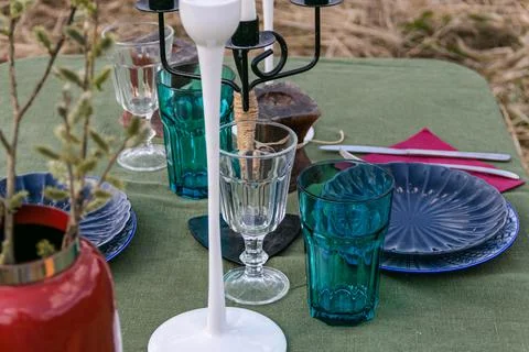 A table set in nature at the dacha in spring for lunch or dinner Stock Photos