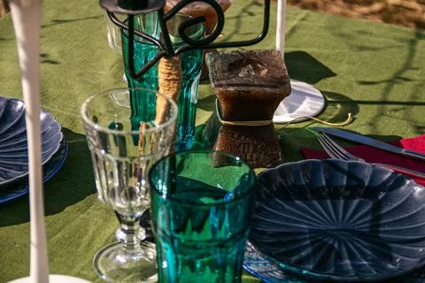 A table set in nature at the dacha in spring for lunch or dinner Stock Photos
