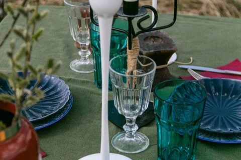 A table set in nature at the dacha in spring for lunch or dinner Stock Photos