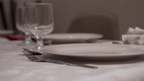 Table Set With plate, fork, knife, spoon and glass Stock Footage 254707840