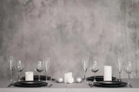 A table set in the restaurant. Serving a table. Grey artistic background. Black Foto stock